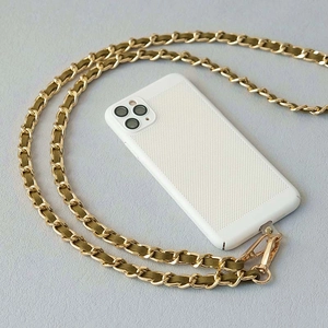 Detail of white mesh iPhone case with premium gold metal and green leather chain strap