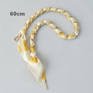 Close-up of 60cm gold chain strap woven with yellow and white silk scarf for handbags