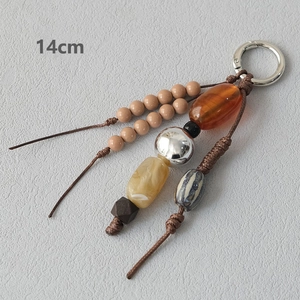Detailed view of a 14cm handmade acrylic bead strap with silver clasp and earthy tones