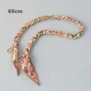 Detail view of 60cm silk scarf chain strap with gold metal links and floral pattern fabric