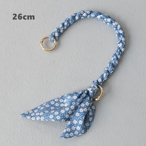Detail of 26cm blue floral fabric woven bag handle strap with golden metal ring clasps