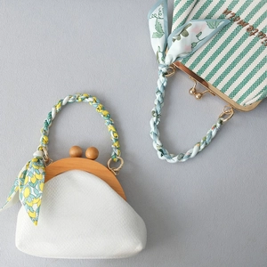 Retro kiss-lock handbags with silk scarf handles and elegant embroidery accents
