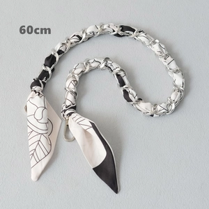 Close-up of 60cm silk scarf chain strap with black and white floral pattern for handbags