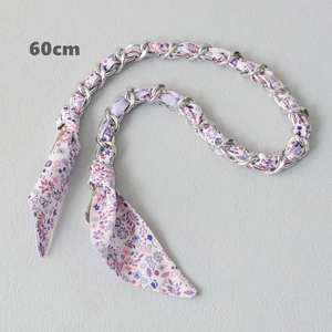 Detail view of 60cm silver chain strap interwoven with purple floral silk fabric for bags