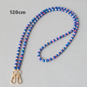 Detailed view of 120cm acrylic bead chain with blue beads and gold metal lobster clasps