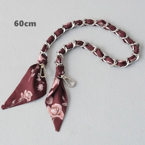Close-up of 60cm silver chain strap woven with red floral silk scarf for handbags