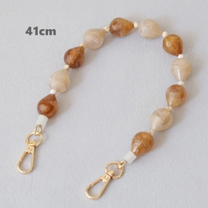 Detailed view of 41cm acrylic water drop bead chain with polished gold metal lobster clasps