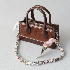 Dark brown faux leather handbag with scarf chain strap and dual top handles