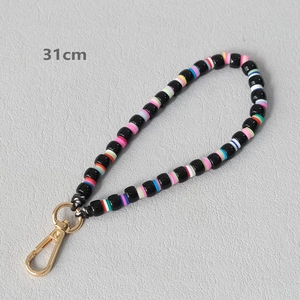 Detail of 31cm handmade candy-colored polymer clay and black bead chain with gold clasp