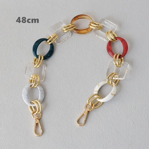 Close-up of a 48cm chunky resin bag strap with colorful acrylic links and gold clasps