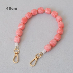 Detail of 40cm pink marble acrylic bead strap with durable gold metal lobster clasps