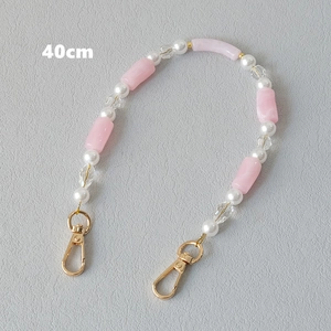 Detail of 40cm acrylic beaded strap with pink resin beads and gold lobster clasps