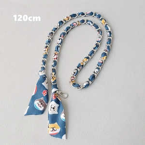 Detail of 120cm silver metal chain woven with cartoon dog print navy silk scarf strap
