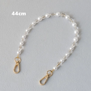 Detail of 44cm acrylic pearl and crystal bead bag strap with gold lobster clasps
