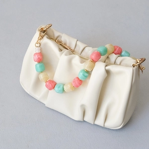 Chic white pleated cloud handbag with colorful resin bead chain and golden hardware