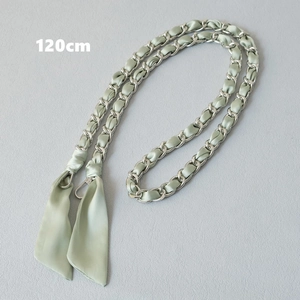 Detail of mint green silk ribbon interwoven with silver chain and 120cm lobster clasp
