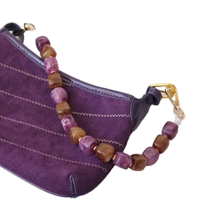 Matte purple underarm bag with V-shaped stitching and marble acrylic bead strap