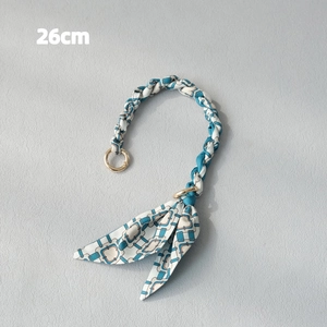 Detail view of 26cm woven silk scarf handbag chain with gold round metal clasps
