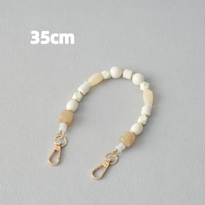 Chaîne en perles acryliques de 35cm avec fermoirs mousquetons dorés en beige et marron
