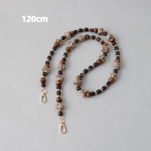 Detail of 120cm phone strap with wooden beads, tiger eye stones, and grey faux fur pompom