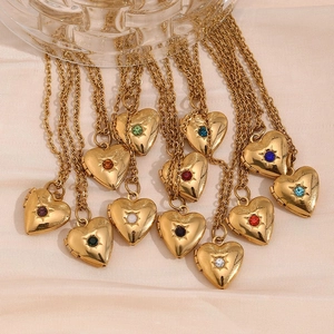 Detail of 18K gold-plated stainless steel heart locket necklaces with colorful birthstones