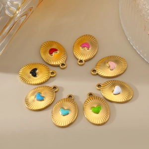 Detailed view of eight colorful enamel heart sunburst pendants in gold plated steel