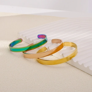 Set of minimalist stainless steel open bangles in gold, rose gold and rainbow finishes