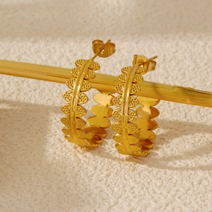 Elegant gold leaf hoop earrings in C-shape design with detailed dot texture for women