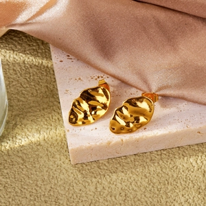 Lava texture irregular gold leaf earrings with modern abstract liquid metal design