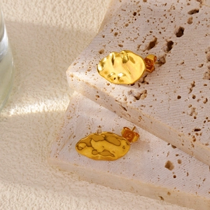 French retro gold irregular leaf stud earrings with lava texture and handmade hammered finish