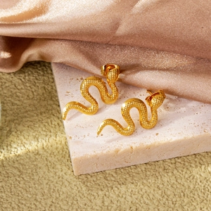 Exquisite 18k gold-plated snake earrings with realistic scale texture on pink stone