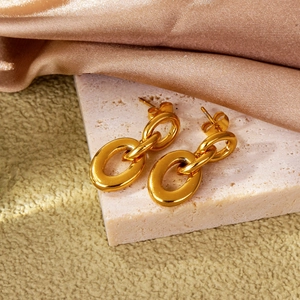 Minimalist double link gold hoop earrings on a decorative stone base for women