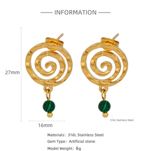 Macro detail of 316L stainless steel gold spiral earrings with green malachite stone beads
