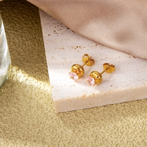 Detail shot of delicate pink zircon earrings in 18k gold plated stainless steel