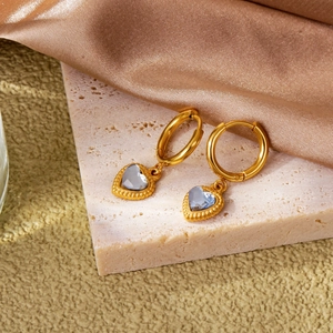 Minimalist 18k gold heart earrings with blue crystal inlay and milgrain detail edges