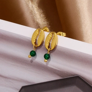 Detail of 18k gold plated shell drop earrings with hanging round green acrylic gemstone