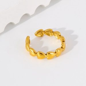 Detail of 18k gold plated stainless steel ring with interlocking heart-shaped design