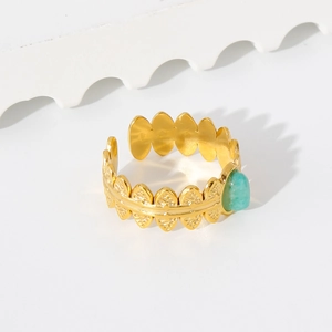 Detail of 18K gold stainless steel open ring with green stone and leaf pattern