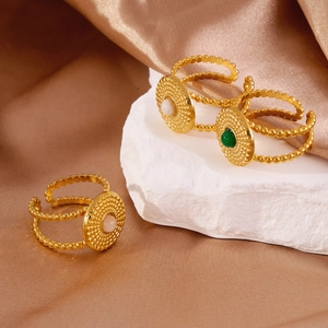 Bohemian adjustable C-shaped rings with sunburst pattern and inlaid gemstones on satin