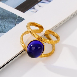 Detailed macro of 18k gold stainless steel ring with vintage blue oval gemstone