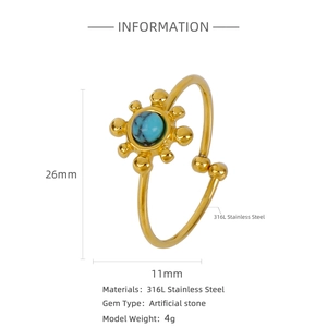 Detail of 316L stainless steel sunflower ring with 18K gold plating and blue stone