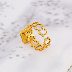 Detail view of 18k gold plated stainless steel open ring with geometric pyramid design