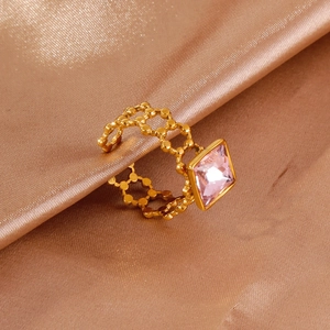 18k gold plated stainless steel ring featuring a square pink crystal on silk fabric