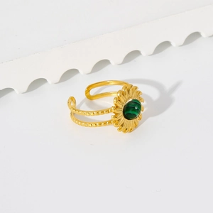 Detailed close-up of a gold-plated stainless steel ring with green malachite stone