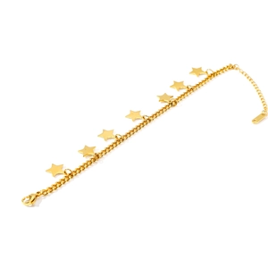 Detail view of gold stainless steel curb chain bracelet with seven star charms and lobster clasp