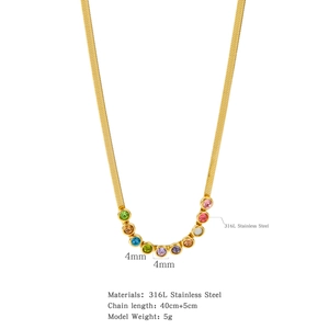 Detail view of gold snake chain necklace with 4mm colorful round zircon stones