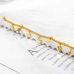 Polished stainless steel gold star charm bracelet featuring 7 pentagrams on a delicate O-chain