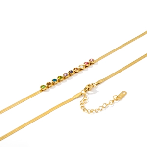 Detailed view of 18K gold plated herringbone chain with colorful zircon stones and clasp