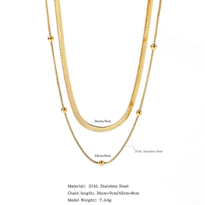 Detail of 18K gold-plated double-layer necklace with flat snake chain and bead chain texture