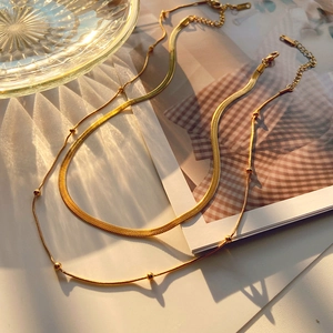 Double-layered 18K gold-plated stainless steel necklace with herringbone and bead chains